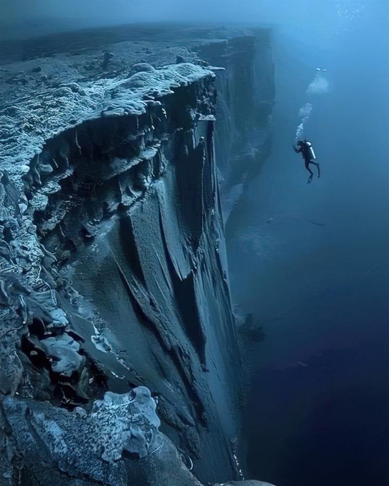 an expansive world leading down to abyssal plains
